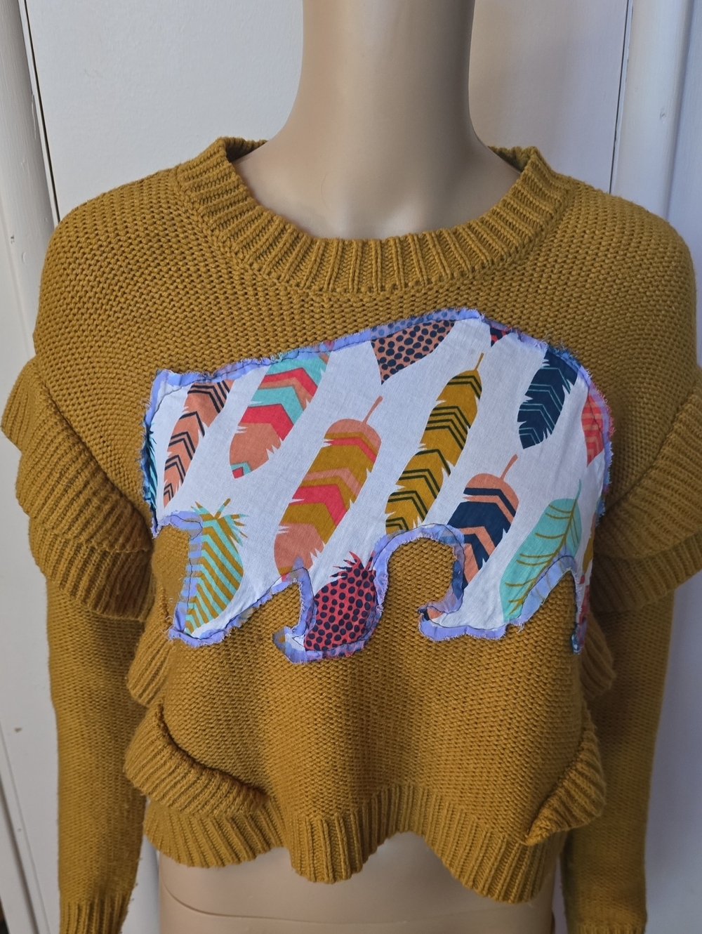 BB Dakota Mustard Yellow Knit Sweater with Feather Bear Appliqué